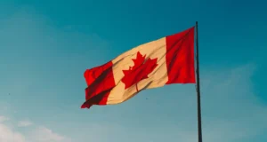 the picture shows the canadian flag convincing the people to move to canada after passing IELTS test